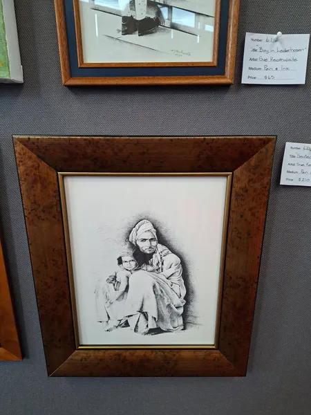 Seated Man and Child by Sue Heathwaite